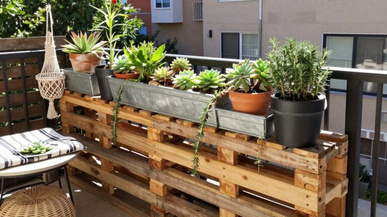 20 Low-Maintenance Pallet Succulent Garden Ideas for Sunny Spots A wooden pallet repurposed as a multi-tiered stand holding potted succulents on a sunny balcony.