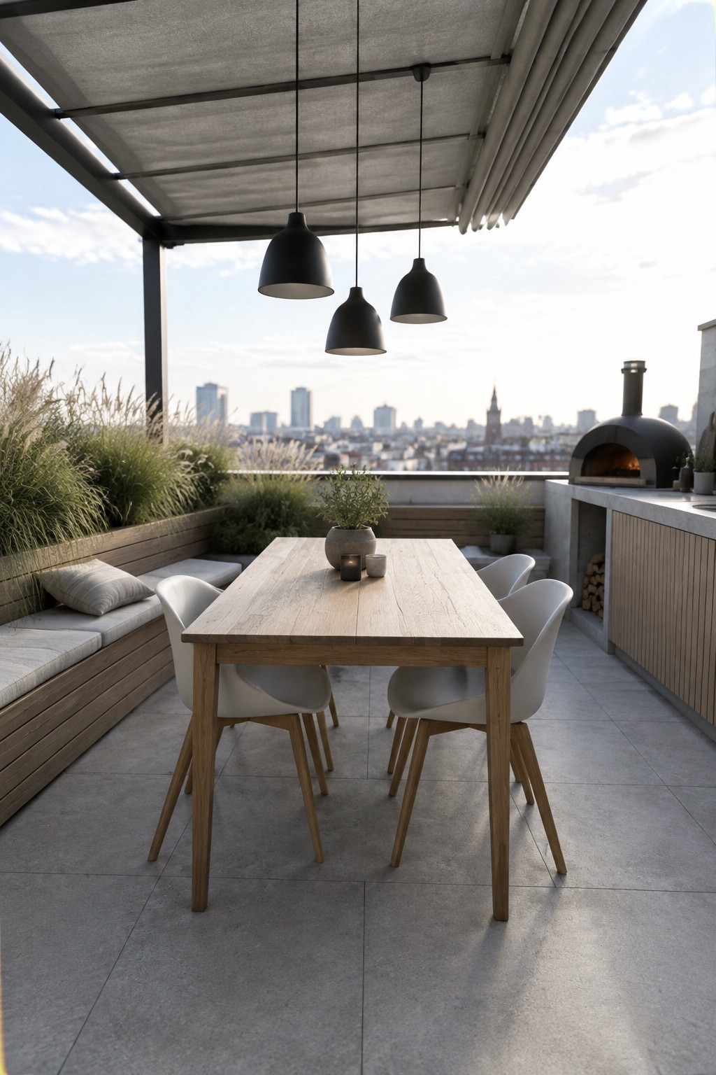 A wooden dining table and white chairs sit beneath a retractable canopy on a rooftop patio.